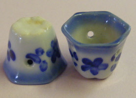 1 small hexigon blue floral ceramic pot with a hole