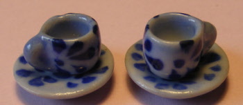 2 blue spotted cups and saucers b69