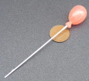 a dolls house miniature balloon pink