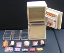a dolls house miniature full fridge