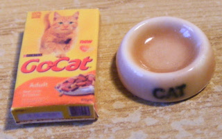 cat bowl and packet salmon