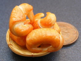 dolls-house-miniature croissants in a basket