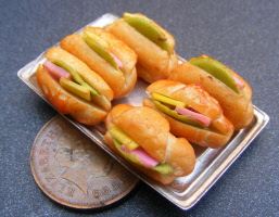 dolls-house-miniature filled croissants in a tray