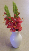 red gladioli in vase