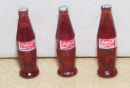 s arge traditional coke bottles