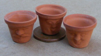 dolls house miniature flower pots with faces